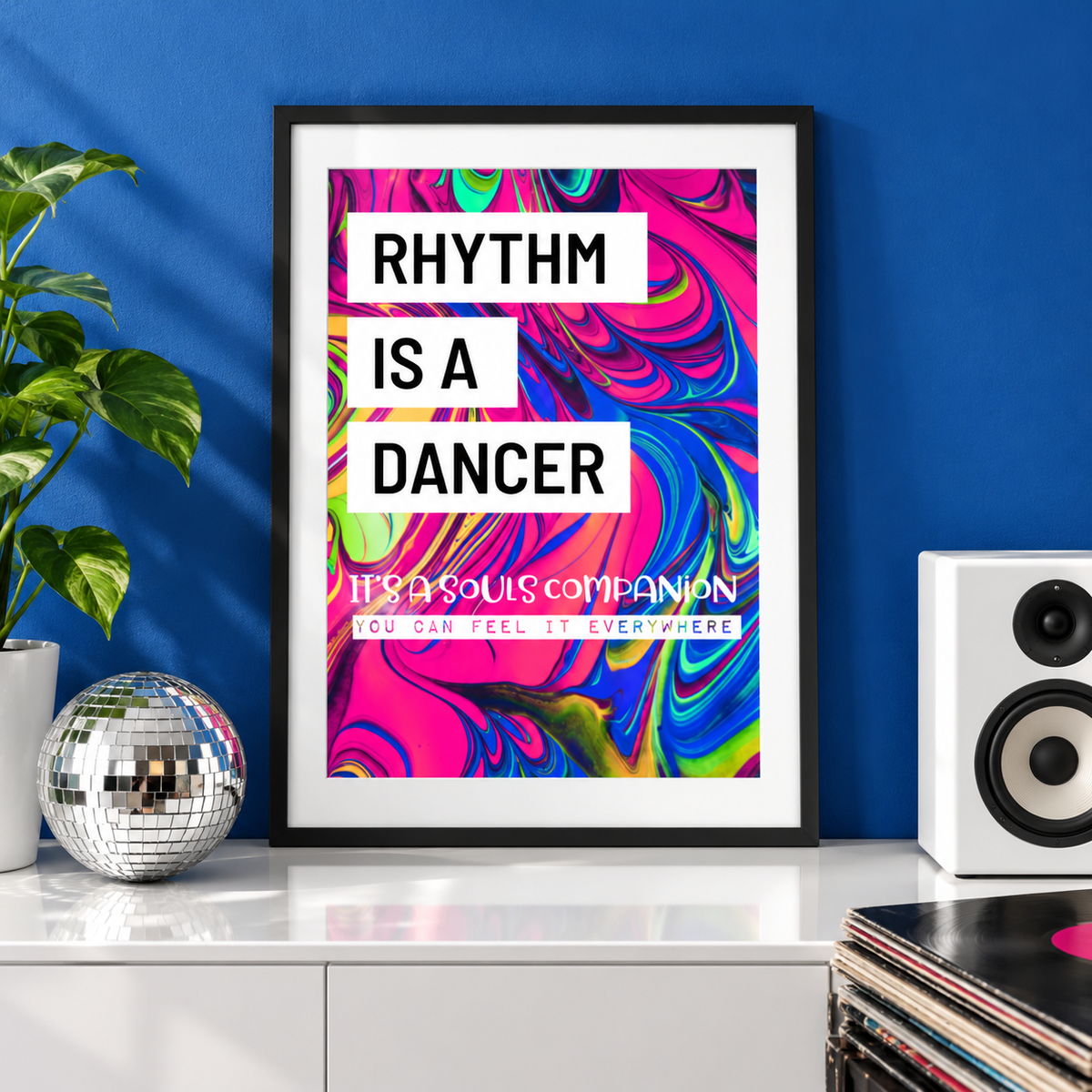 Rhythm Is a Dancer music print in a black frame on a white console
