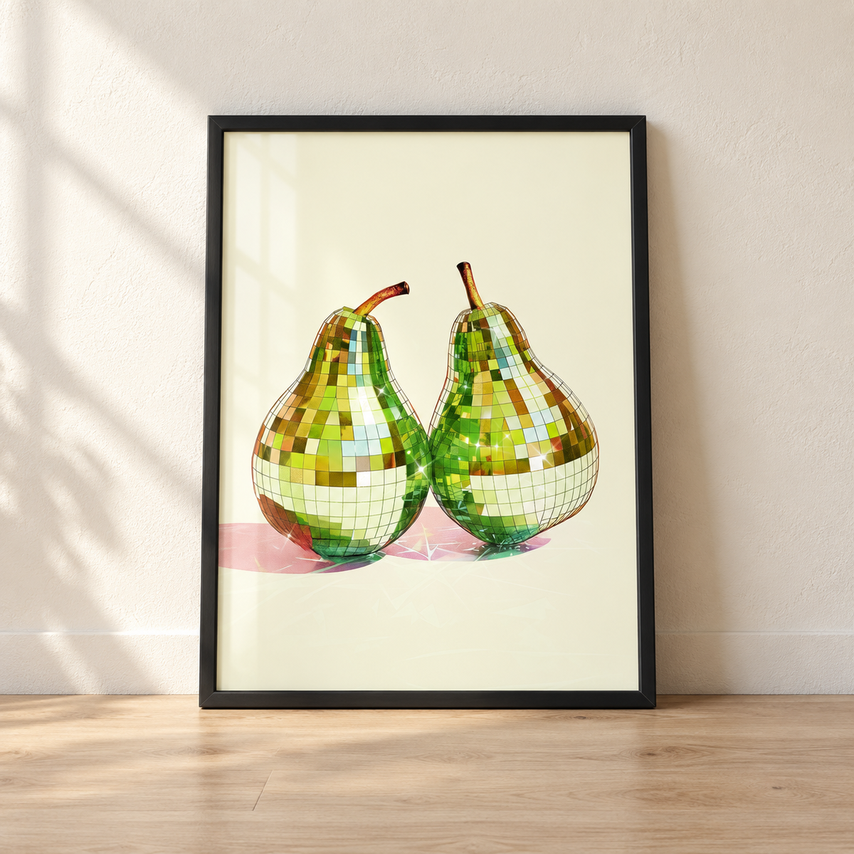 Disco Ball Pears print in a glossy black frame leaning against a wall
