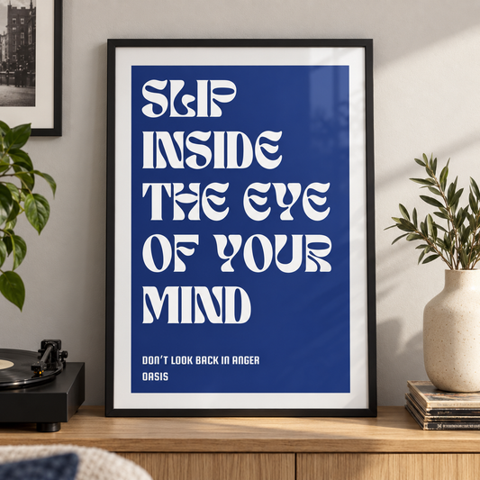 Don't Look Back in Anger Oasis lyric print in a black frame beside a record player