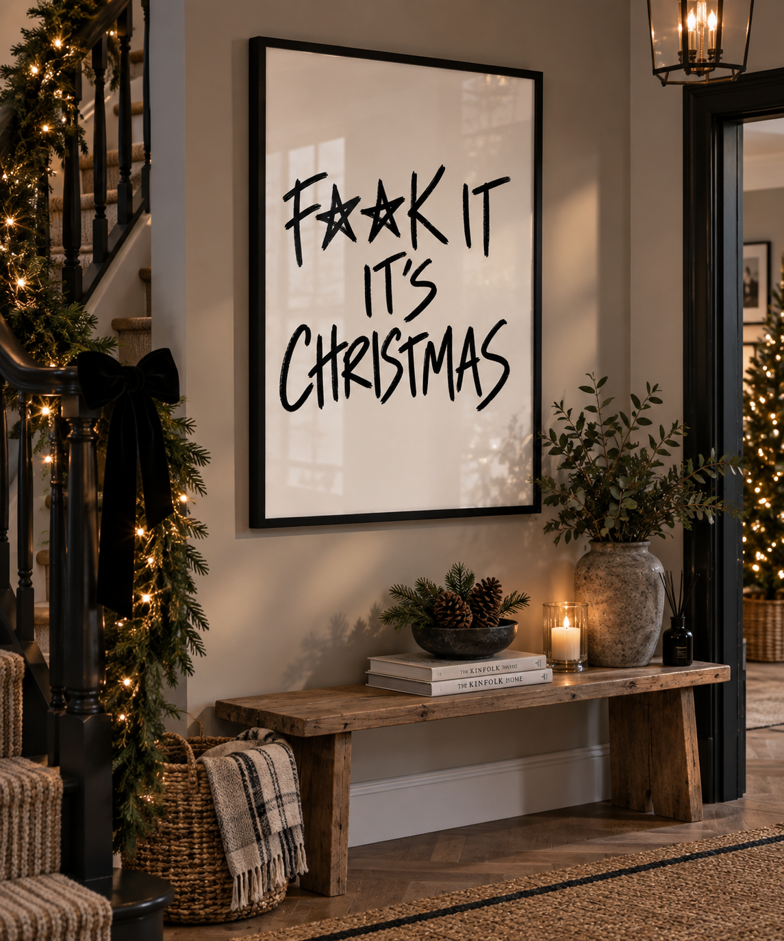 F**k It It's Christmas print in a black frame in a festive hallway