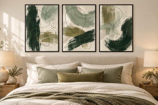 Forest sage and olive abstract set of three shown in black frames in a bedroom; frames not included
