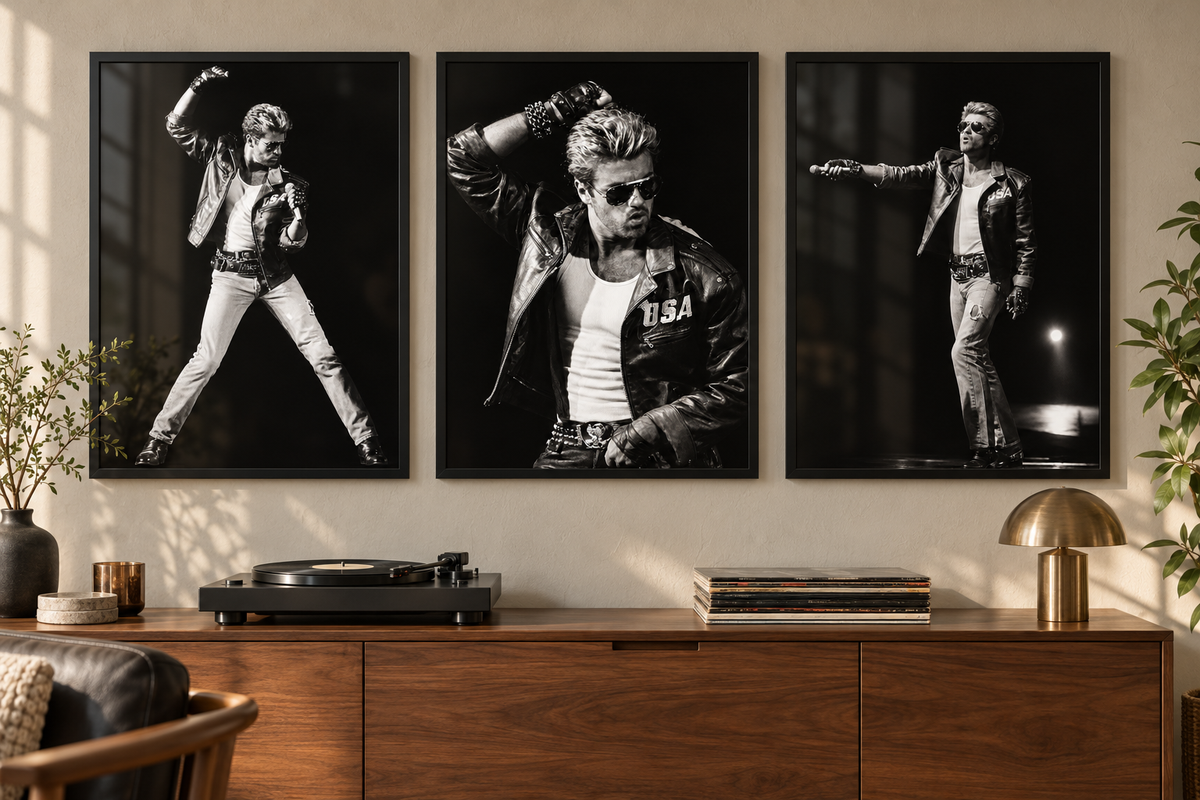 Set of three George Michael black-and-white concert prints displayed in matching black frames above a walnut sideboard
