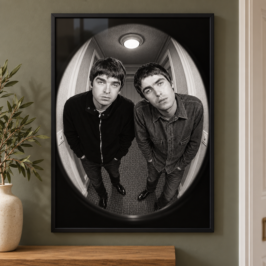 Liam and Noel Gallagher Who’s at the Door print displayed in a black frame in a modern hallway