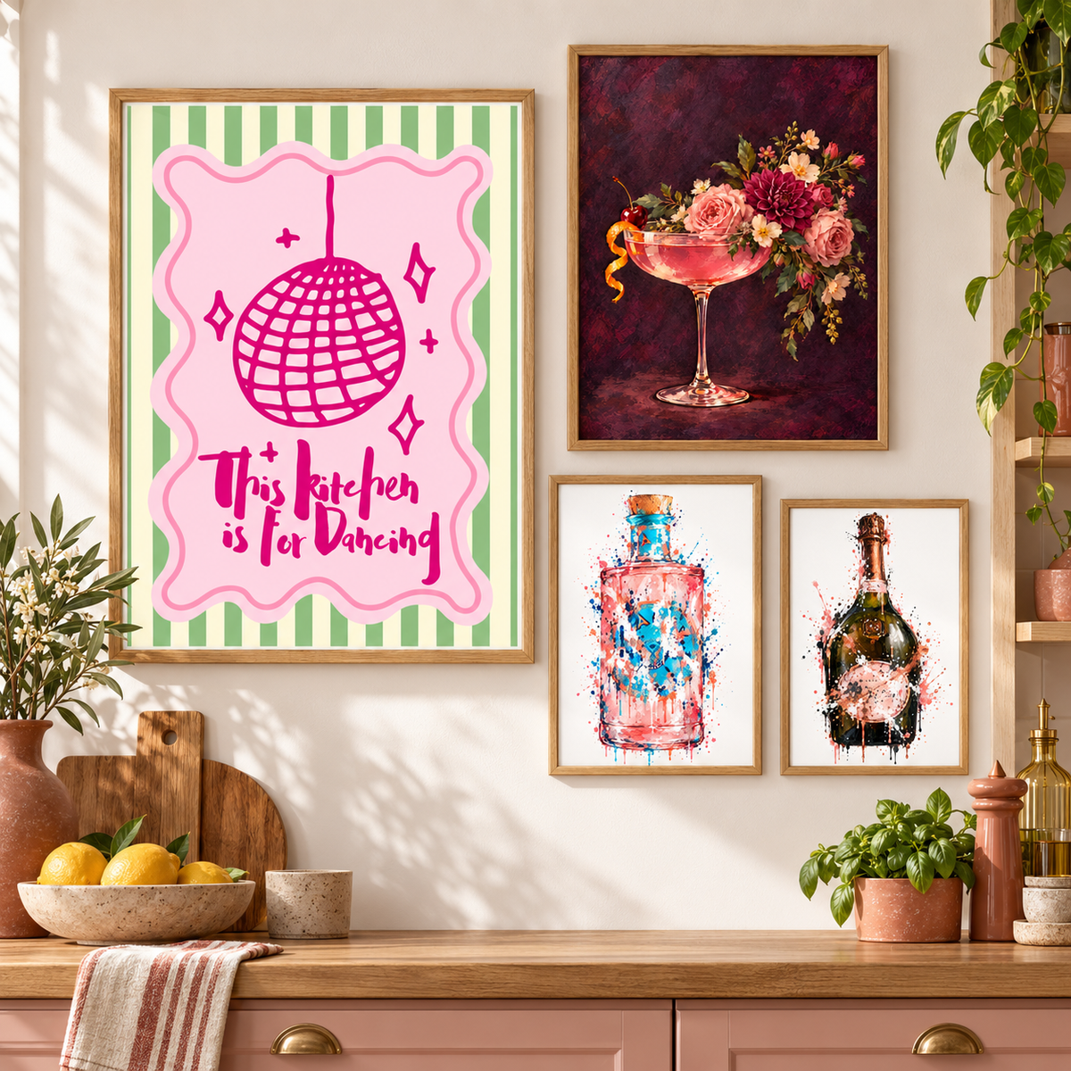 Pink kitchen gallery wall with dancing typography, floral cocktail coupe, Malfy gin and Laurent Perrier prints