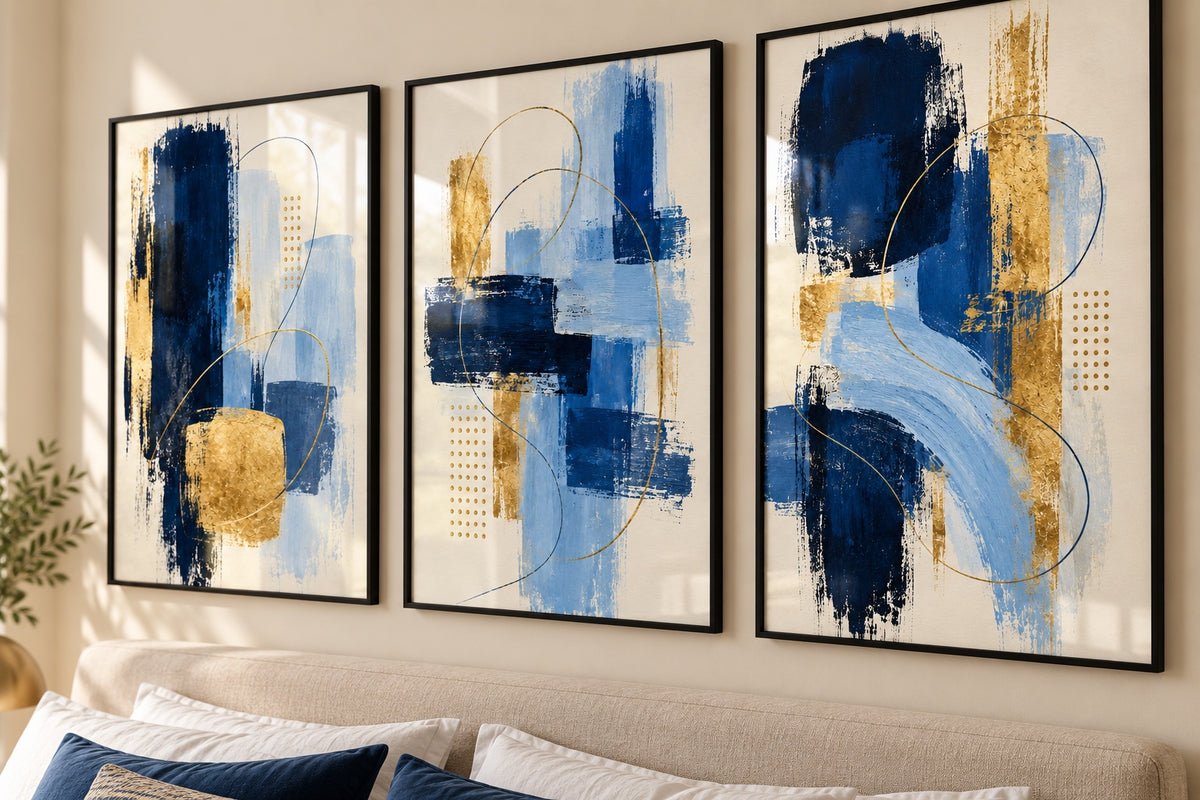 Angled close-up of navy, blue and gold abstract prints; frames not included
