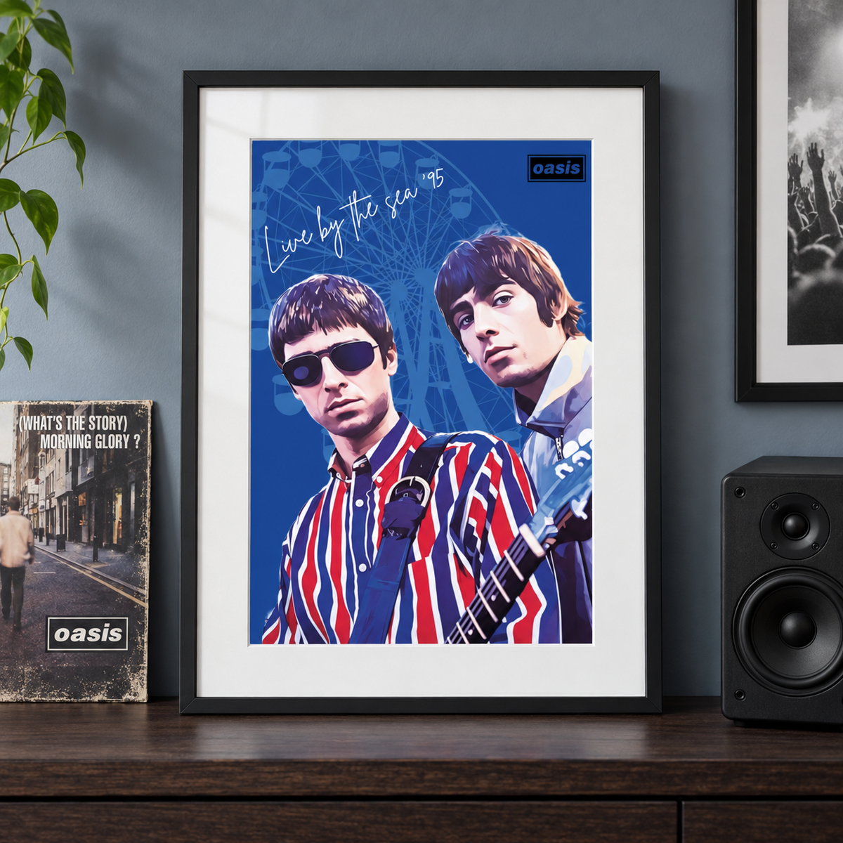 Oasis Live by the Sea Liam and Noel print in a black frame in a music room