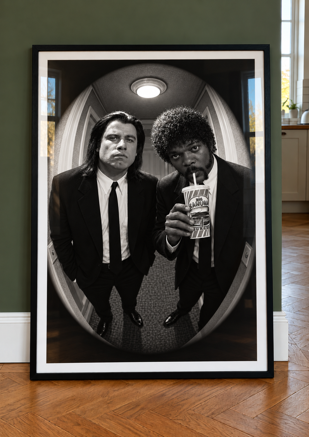 Vincent and Jules peephole print in a black frame against a green wall