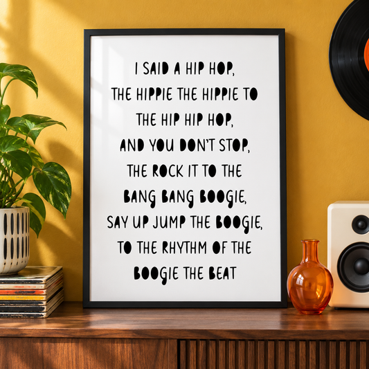 Rapper's Delight Sugarhill Gang lyric print in a black frame on a walnut console