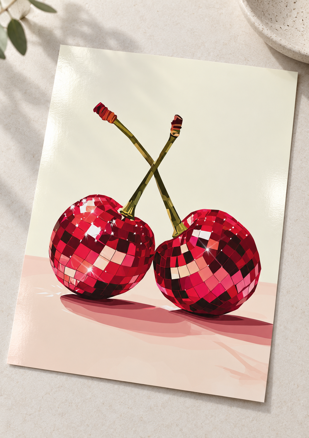 Unframed Red Cherry Disco Ball art print on a surface