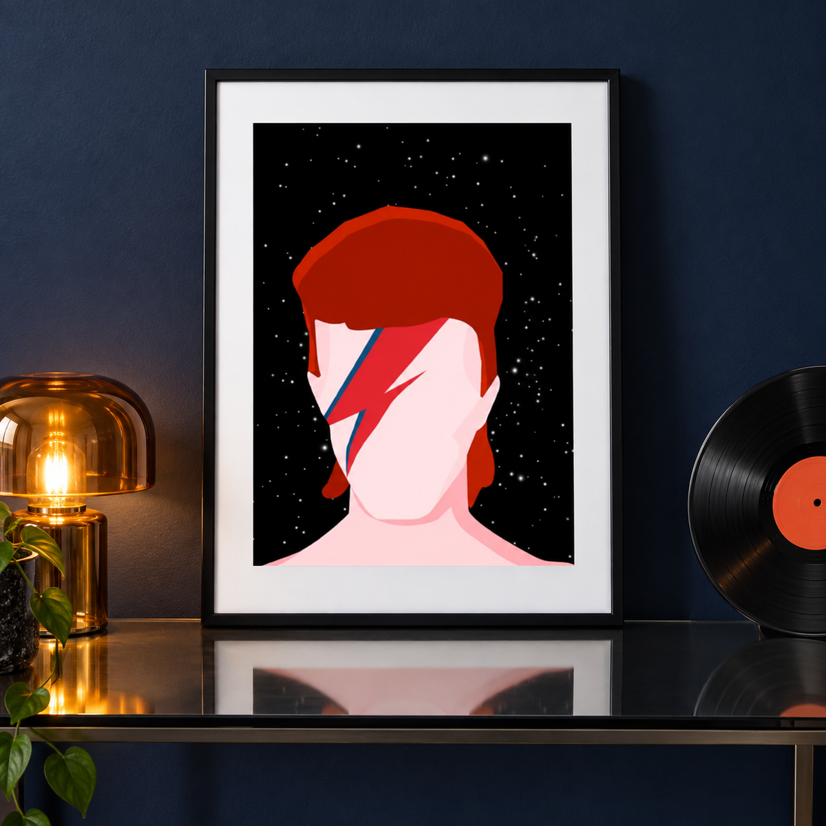Ziggy Stardust Bowie music print in a black frame on a glass console